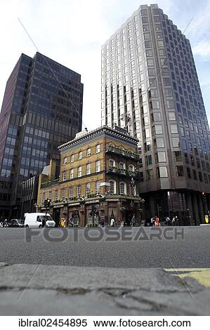 Stock Photography - "St. Albert Pub in Victoria Street, old building in between modern office buildings, London, England, United Kingdom, Europe, PublicGround, Europe". Fotosearch