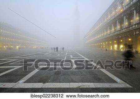 Stock Image - "St. Mark's Square, the Procuratie buildings and St. Mark's Campanile in the mist, Venice, Venezia, Veneto, Italy, Europe". Fotosearch