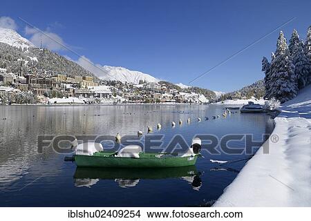 "St. Moritz village, lake St. Moritzersee and a boat in the foreground, canton of Grisons, Engadin, Switzerland, Europe" View Large Photo Image Picture - "St. Moritz village, lake St. Moritzersee and a boat in the foreground, canton of Grisons, Engadin, Switzerland, Europe". Fotosearch
