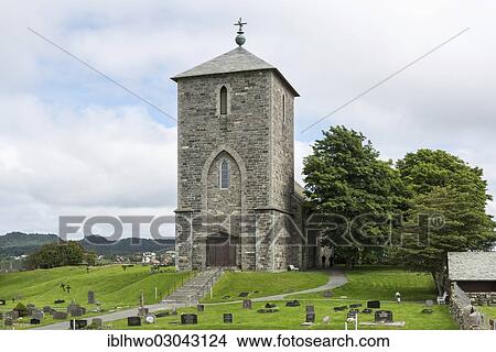 Picture - "St. Olav's Church in Avaldsnes, with grave stones at the front, Avaldsnes, Insel Karmoy, Rogaland, Western Norway, Norway, Europe". Fotosearch