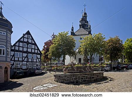 "St. Peter's Fountain with the town coat of arms and the Church of St. Heribert in Hallenberg, Hochsauerlandkreis district, North Rhine-Westphalia, Germany, Europe, PublicGround, Europe" View Large Photo Image Stock Photo - "St. Peter's Fountain with the town coat of arms and the Church of St. Heribert in Hallenberg, Hochsauerlandkreis district, North Rhine-Westphalia, Germany, Europe, PublicGround, Europe". Fotosearch