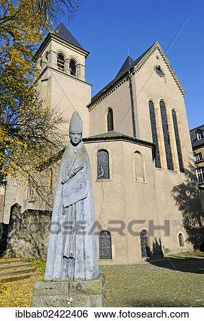 Stock Photograph - St. Willibrord, sculpture of the monk, Peter and Paul Church, Echternach, Luxembourg, Europe, PublicGround, Europe. Fotosearch