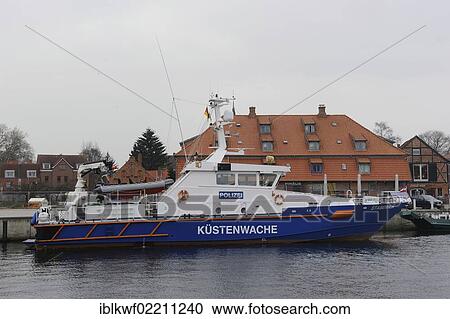 "Staberhuk Coast Guard boat in the port of Neustadt in Holstein, traditional grain silo at back, Neustadt, Schleswig-Holstein, Germany, Europe" View Large Photo Image Stock Image - "Staberhuk Coast Guard boat in the port of Neustadt in Holstein, traditional grain silo at back, Neustadt, Schleswig-Holstein, Germany, Europe". Fotosearch