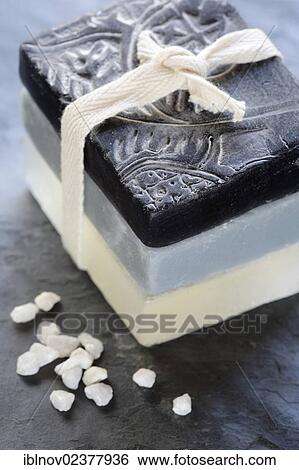 Stock Photograph - Stack of soap bars with bath salts. Fotosearch