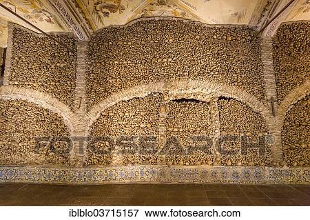 Stock Photo - "Stacked bones and skulls in the ossuary, Capela dos ossos parede, chapel of the bones, bones chapel, Evora, Evora District, Portugal, Europe". Fotosearch