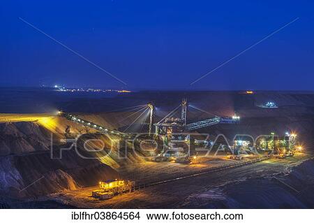 "Stacker and conveyor in the Garzweiler open pit at night, Grevenbroich, North Rhine-Westphalia, Germany, Europe" View Large Photo Image Picture - "Stacker and conveyor in the Garzweiler open pit at night, Grevenbroich, North Rhine-Westphalia, Germany, Europe". Fotosearch