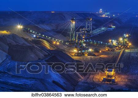 "Stacker and conveyor in the Garzweiler open pit at night, Grevenbroich, North Rhine-Westphalia, Germany, Europe" View Large Photo Image Stock Image - "Stacker and conveyor in the Garzweiler open pit at night, Grevenbroich, North Rhine-Westphalia, Germany, Europe". Fotosearch