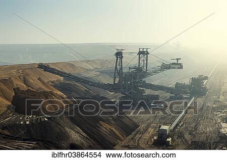 "Stacker, Garzweiler open pit in the early morning fog, Grevenbroich, North Rhine-Westphalia, Germany, Europe" View Large Photo Image Picture - "Stacker, Garzweiler open pit in the early morning fog, Grevenbroich, North Rhine-Westphalia, Germany, Europe". Fotosearch
