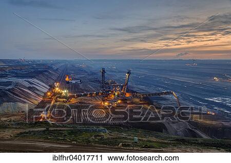"Stacker in the Garzweiler open pit in the blue hour, Grevenbroich, North Rhine-Westphalia, Germany, Europe" View Large Photo Image Stock Image - "Stacker in the Garzweiler open pit in the blue hour, Grevenbroich, North Rhine-Westphalia, Germany, Europe". Fotosearch