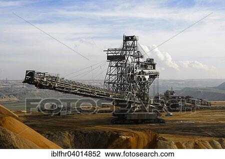 "Stacker in the Garzweiler surface mine at the top of the pit, Grevenbroich, North Rhine-Westphalia, Germany, Europe" View Large Photo Image Stock Image - "Stacker in the Garzweiler surface mine at the top of the pit, Grevenbroich, North Rhine-Westphalia, Germany, Europe". Fotosearch