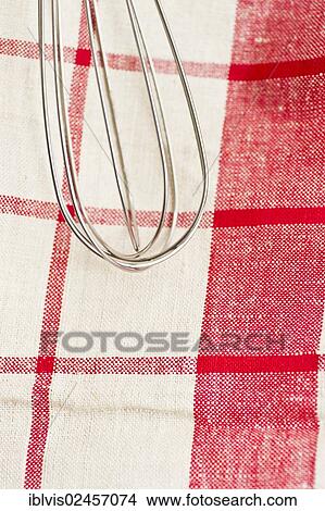 Stainless whisk on tea-towel View Large Photo Image Picture - Stainless whisk on tea-towel. Fotosearch