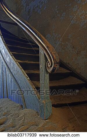 "Staircase in a house that has been filled by desert sand, in the former diamond city of Kolmanskuppe, now a ghost town, Kolmannskuppe, Karas Region, Namibia, Africa" View Large Photo Image Stock Photo - "Staircase in a house that has been filled by desert sand, in the former diamond city of Kolmanskuppe, now a ghost town, Kolmannskuppe, Karas Region, Namibia, Africa". Fotosearch