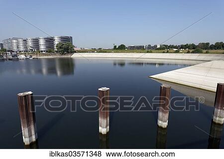 "Stairs at the former Holzhafen, timber port, with the planned construction project """"Eurogate"""" by Sir Norman Foster, Innenhafen, Duisburg, Ruhr district, North Rhine-Westphalia, Germany, Europe" View Large Photo Image Stock Photo - "Stairs at the former Holzhafen, timber port, with the planned construction project """"Eurogate"""" by Sir Norman Foster, Innenhafen, Duisburg, Ruhr district, North Rhine-Westphalia, Germany, Europe". Fotosearch
