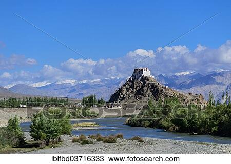 Stock Image - "Stakna Gompa, built on a hill high above the Indus river, Ladakh, Jammu and Kashmir, India, Asia". Fotosearch