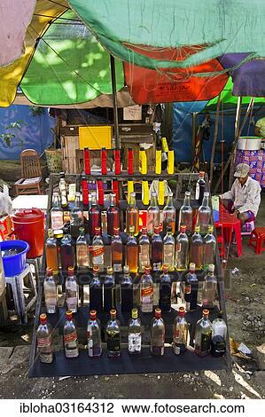 Stock Image - "Stand selling gasoline in bottles, Upper Pansodan Street, Rangun, Yangon Region, Myanmar, Burma, Asia". Fotosearch