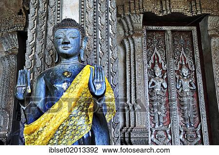 "Standing Buddha statue in front of the Lao National Museum in Vientiane, Laos, Southeast Asia, Asia" View Large Photo Image Stock Image - "Standing Buddha statue in front of the Lao National Museum in Vientiane, Laos, Southeast Asia, Asia". Fotosearch