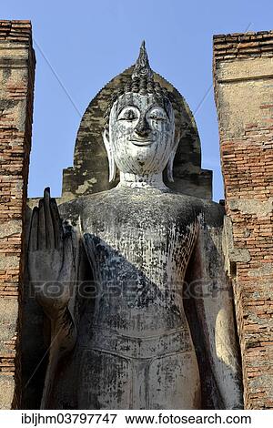 "Standing Buddha statue Phra Attharot, Wat Mahathat temple complex, Sukhothai Historical Park, Sukhothai, Northern Thailand, Thailand, Asia" View Large Photo Image Stock Photo - "Standing Buddha statue Phra Attharot, Wat Mahathat temple complex, Sukhothai Historical Park, Sukhothai, Northern Thailand, Thailand, Asia". Fotosearch