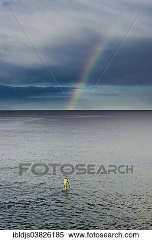 "Standing paddler and a rainbow, L'Escala, Girona province, Costa Brava, Spain, Europe" View Large Photo Image Stock Photography - "Standing paddler and a rainbow, L'Escala, Girona province, Costa Brava, Spain, Europe". Fotosearch