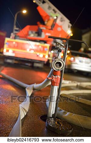 Standpipe on an underground hydrant, a turntable ladder truck of the Backnang volunteer fire department at the back, Stuttgart, Baden-Wuerttemberg, Germany, Europe View Large Photo Image Stock Image - Standpipe on an underground hydrant, a turntable ladder truck of the Backnang volunteer fire department at the back, Stuttgart, Baden-Wuerttemberg, Germany, Europe. Fotosearch