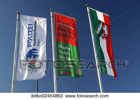"State flag of North Rhine-Westphalia, Flag of the police department of Cologne, flying outside the police headquarters in Cologne-Kalk, Cologne, North Rhine-Westphalia, Germany, Europe" View Large Photo Image Stock Image - "State flag of North Rhine-Westphalia, Flag of the police department of Cologne, flying outside the police headquarters in Cologne-Kalk, Cologne, North Rhine-Westphalia, Germany, Europe". Fotosearch