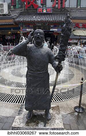 Stock Photo - "Statue, barker in an arcade, Beijing, China, People's Republic of China, Asia". Fotosearch