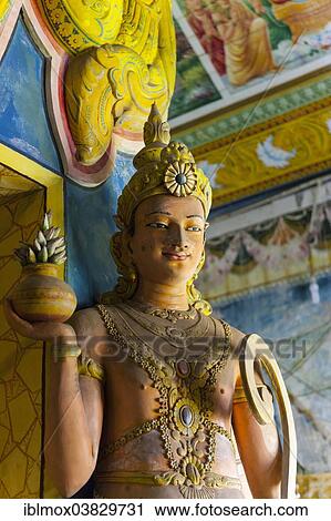 Stock Image - "Statue in the old Buddhist temple complex of Sri Pushparama Maha Viharaya, near Balapitiya, Welitara Region, Southern Province, Sri Lanka, Asia". Fotosearch