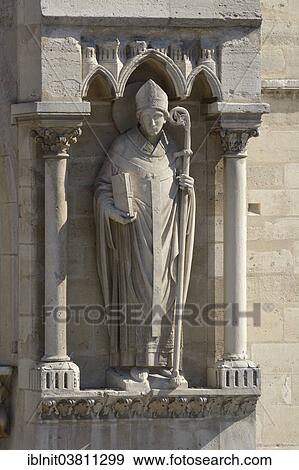 "Statue of a bishop, facade of Cathedrale Notre Dame, Paris, Ile-de-France, France, Europe" View Large Photo Image Stock Photo - "Statue of a bishop, facade of Cathedrale Notre Dame, Paris, Ile-de-France, France, Europe". Fotosearch