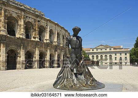 "Statue of a bullfighter in front of the Roman amphitheatre, Nimes, Region Languedoc-Roussillon, France, Europe" View Large Photo Image Stock Image - "Statue of a bullfighter in front of the Roman amphitheatre, Nimes, Region Languedoc-Roussillon, France, Europe". Fotosearch