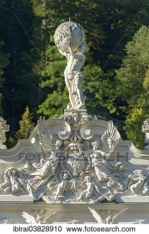 "Statue of Atlas holding the celestial sphere, angels and putti around the Bavarian coat of arms on the pediment of Schloss Linderhof Palace, Upper Bavaria, Bavaria, Germany, Europe" View Large Photo Image Stock Image - "Statue of Atlas holding the celestial sphere, angels and putti around the Bavarian coat of arms on the pediment of Schloss Linderhof Palace, Upper Bavaria, Bavaria, Germany, Europe". Fotosearch