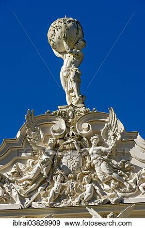"Statue of Atlas holding the celestial sphere, angels and putti around the Bavarian coat of arms on the pediment of Schloss Linderhof Palace, Upper Bavaria, Bavaria, Germany, Europe" View Large Photo Image Stock Photo - "Statue of Atlas holding the celestial sphere, angels and putti around the Bavarian coat of arms on the pediment of Schloss Linderhof Palace, Upper Bavaria, Bavaria, Germany, Europe". Fotosearch