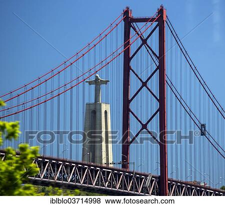 "Statue of Christ, Cristo Rei, built in 1959, 113m high, seen through the Ponte 25 de Abril bridge, Lisbon, Lisbon District, Portugal, Europe" View Large Photo Image Stock Photo - "Statue of Christ, Cristo Rei, built in 1959, 113m high, seen through the Ponte 25 de Abril bridge, Lisbon, Lisbon District, Portugal, Europe". Fotosearch