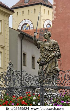 Picture - "Statue of Lady Justice, Fountain of Justice, Haidplatz square, tower of the town hall, old town of Regensburg, Upper Palatinate, Bavaria, Germany, Europe". Fotosearch