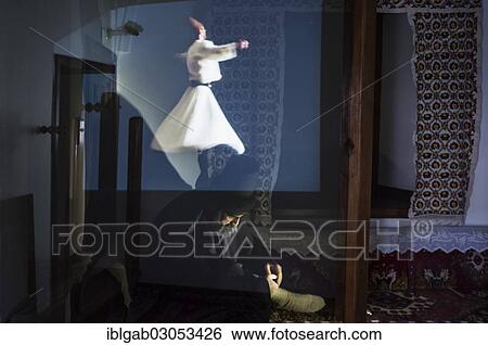 "Statue of Mevlana under an holographic projection of a whirling dervish, Konya, Anatolia, Turkey, Asia" View Large Photo Image Stock Photograph - "Statue of Mevlana under an holographic projection of a whirling dervish, Konya, Anatolia, Turkey, Asia". Fotosearch