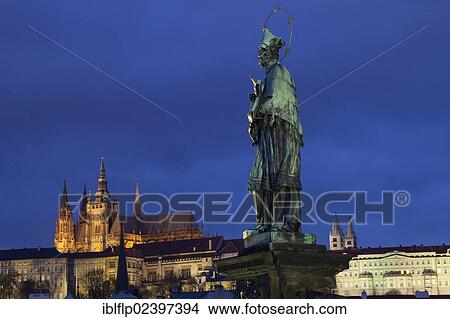 "Statue of Nepomuk with castle and cathedral illuminated at night, Charles Bridge, Vltava River, St. Vitus Cathedral, Prague Castle, Prague, Czech Republic, Europe" View Large Photo Image Picture - "Statue of Nepomuk with castle and cathedral illuminated at night, Charles Bridge, Vltava River, St. Vitus Cathedral, Prague Castle, Prague, Czech Republic, Europe". Fotosearch