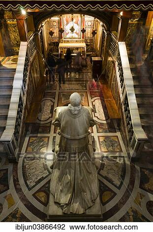 Stock Image - "Statue of Pope Pius IX, by Ignazio Jacometti, 1883, believers praying in front of the relic of the crib or manger in the Confessio, designed by Virginio Vespignani, Papal Basilica of Santa Maria Maggiore, Vatican, Rome, Lazio, Italy, Europe". Fotosearch