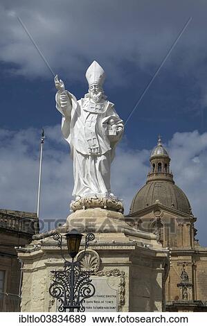 Stock Photo - "Statue of St. Nicholas in front of the Parish Church of San Nicholas, Siggiewi, Malta, Europe". Fotosearch