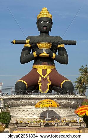 "Statue of Ta Dambong, a black man with a magic wand, symbol of the provincial capital of Battambang, Cambodia, Southeast Asia, Asia" View Large Photo Image Picture - "Statue of Ta Dambong, a black man with a magic wand, symbol of the provincial capital of Battambang, Cambodia, Southeast Asia, Asia". Fotosearch