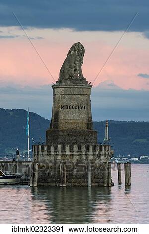 Stock Image - "Statue of the Bavarian lion at the harbor entrance of Lindau harbor, Lake Constance, Bavaria, Germany, Europe". Fotosearch