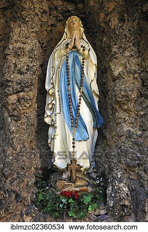 "Statue of the Virgin Mary in a grotto at the Parish Church of St. Kunigund, market square, Schnaittach, Middle Franconia, Bavaria, Germany, Europe" View Large Photo Image Picture - "Statue of the Virgin Mary in a grotto at the Parish Church of St. Kunigund, market square, Schnaittach, Middle Franconia, Bavaria, Germany, Europe". Fotosearch