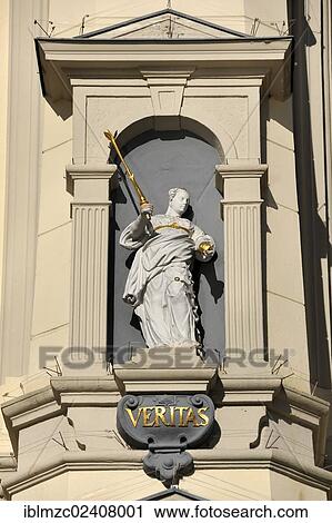 Stock Image - "Statue of Veritas, the goddess of truth, on the baroque facade of the city hall, 1704, Am Markt square 1, Lueneburg, Lower Saxony, Germany, Europe, PublicGround, Europe". Fotosearch