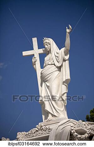 "Statue on a grave in Cementerio Cristobal Colon, the largest cemetery in Latin America, Havana, Cuba, North America" View Large Photo Image Stock Image - "Statue on a grave in Cementerio Cristobal Colon, the largest cemetery in Latin America, Havana, Cuba, North America". Fotosearch