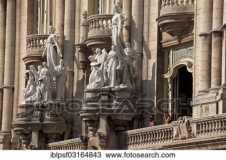 Stock Image - "Statues and a balcony with visitors on the facade of the Gran Teatro de La Habana theater, Havana, Cuba, North America". Fotosearch