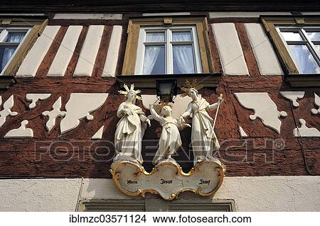 "Statues of saints, the Holy Family, on a half-timbered house, Hassfurt, Lower Franconia, Bavaria, Germany, Europe" View Large Photo Image Picture - "Statues of saints, the Holy Family, on a half-timbered house, Hassfurt, Lower Franconia, Bavaria, Germany, Europe". Fotosearch