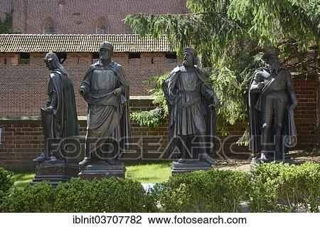 Stock Image - "Statues of the Grand Masters of the Teutonic Knights, Castle of the Teutonic Order in Malbork, Europe's largest medieval castle complex, Malbork, Pomeranian Voivodeship, Poland, Europe". Fotosearch