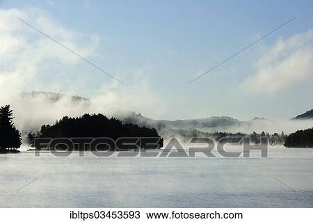 "Steam clouds moving across Lac Tremblant, Mont-Tremblant, Quebec Province, Canada, North America" View Large Photo Image Stock Image - "Steam clouds moving across Lac Tremblant, Mont-Tremblant, Quebec Province, Canada, North America". Fotosearch