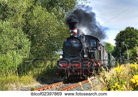 "Steam engine Karoline of the Arbeitsgemeinschaft Geesthachter Eisenbahn railroad in Bergedorf, Hamburg, Germany, Europe" View Large Photo Image Stock Photo - "Steam engine Karoline of the Arbeitsgemeinschaft Geesthachter Eisenbahn railroad in Bergedorf, Hamburg, Germany, Europe". Fotosearch