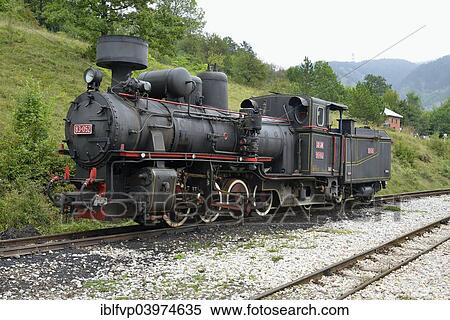 "Steam locomotive of the Sargan Eight, narrow-gauge heritage railway from Mokra Gora to Sargan Vitasi, Mokra Gora, Serbia, Europe" View Large Photo Image Stock Photography - "Steam locomotive of the Sargan Eight, narrow-gauge heritage railway from Mokra Gora to Sargan Vitasi, Mokra Gora, Serbia, Europe". Fotosearch