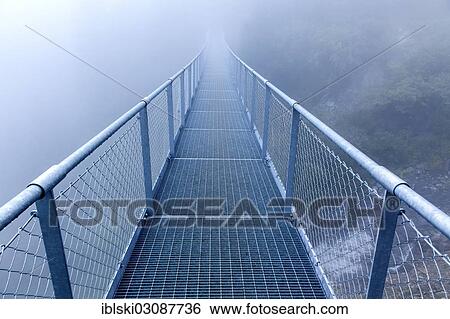 "Steel bridge in the fog crossing over an Alpine stream, bei Algund, South Tyrol province, Trentino-Alto Adige, Italy, Europe" View Large Photo Image Stock Photograph - "Steel bridge in the fog crossing over an Alpine stream, bei Algund, South Tyrol province, Trentino-Alto Adige, Italy, Europe". Fotosearch
