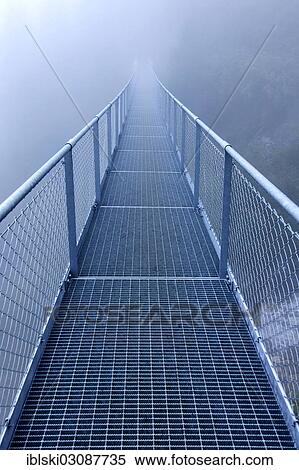 "Steel bridge in the fog crossing over an Alpine stream, bei Algund, South Tyrol province, Trentino-Alto Adige, Italy, Europe" View Large Photo Image Stock Photography - "Steel bridge in the fog crossing over an Alpine stream, bei Algund, South Tyrol province, Trentino-Alto Adige, Italy, Europe". Fotosearch