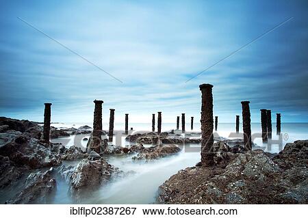 "Steel stantions of ruined Victorian pier visable on shore at low tide, Westward Ho, North Devon, England, United Kingdom, Europe" View Large Photo Image Stock Photo - "Steel stantions of ruined Victorian pier visable on shore at low tide, Westward Ho, North Devon, England, United Kingdom, Europe". Fotosearch